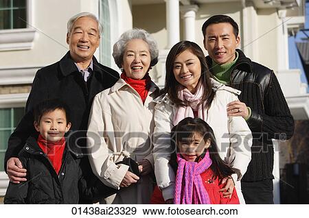 Family smiling at camera View Large Photo Image Stock Photo - Family smiling at camera. Fotosearch