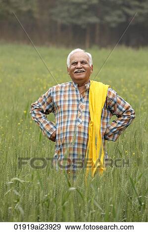 Stock Photo - Farmer in field. Fotosearch