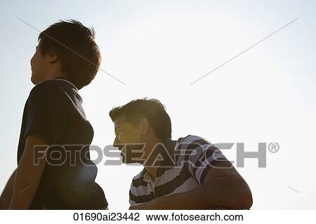 Father and son at the beach View Large Photo Image Stock Image - Father and son at the beach. Fotosearch