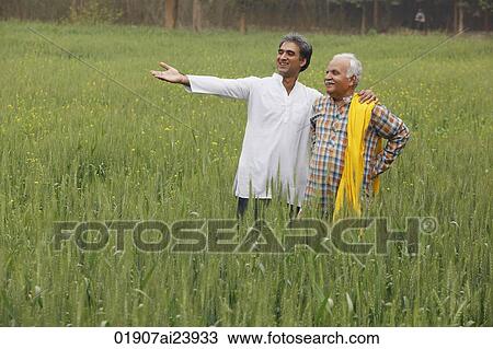 father and son farmers in field View Large Photo Image Stock Image - father and son farmers in field. Fotosearch