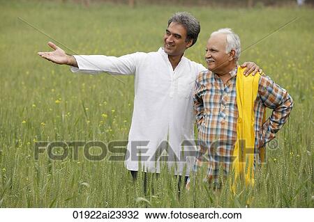 father and son farmers in field View Large Photo Image Stock Image - father and son farmers in field. Fotosearch