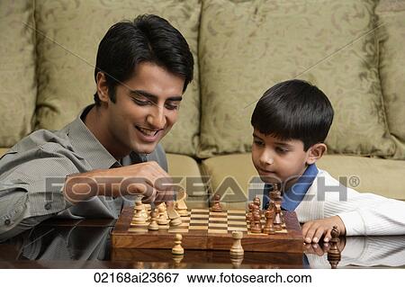father and son play chess View Large Photo Image Stock Photo - father and son play chess. Fotosearch