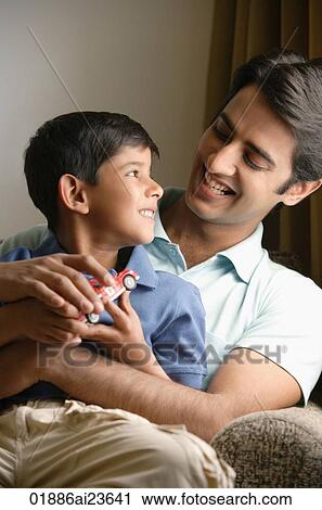 father and son smile at each other, red truck View Large Photo Image Stock Image - father and son smile at each other, red truck. Fotosearch