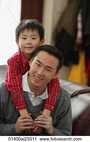Father and son smiling at camera View Large Photo Image Stock Image - Father and son smiling at camera. Fotosearch