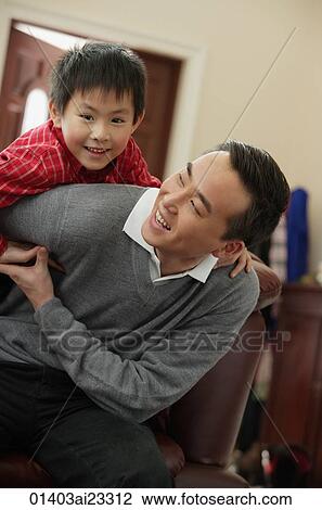 Father and son smiling at camera View Large Photo Image Stock Image - Father and son smiling at camera. Fotosearch