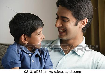father and son smiling at each other View Large Photo Image Stock Photography - father and son smiling at each other. Fotosearch