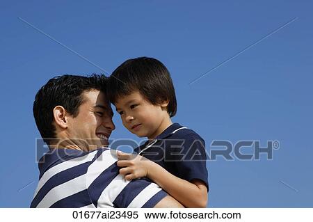 Father carrying son View Large Photo Image Stock Photography - Father carrying son. Fotosearch