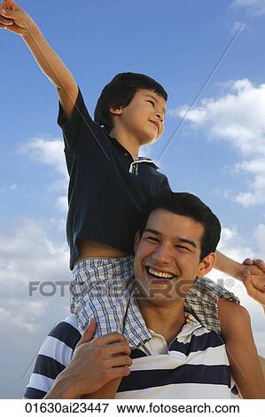 Stock Photo - Father piggybacking son. Fotosearch