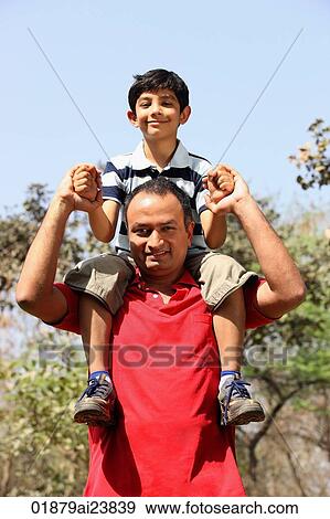 Father with son on his shoulders View Large Photo Image Stock Photo - Father with son on his shoulders. Fotosearch