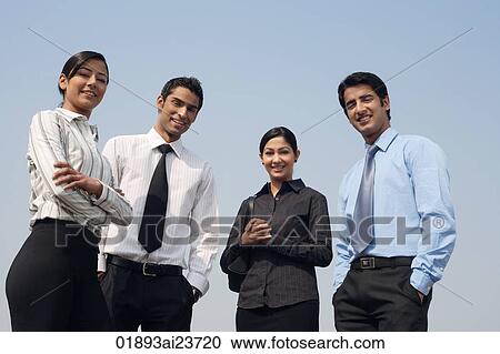 four business colleagues, facing camera View Large Photo Image Stock Image - four business colleagues, facing camera. Fotosearch