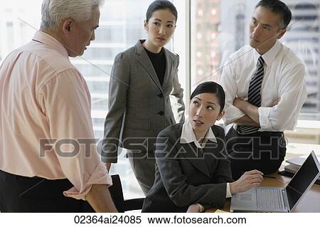 four business people talking View Large Photo Image Stock Photography - four business people talking. Fotosearch