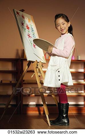 Girl painting on canvas View Large Photo Image Stock Image - Girl painting on canvas. Fotosearch