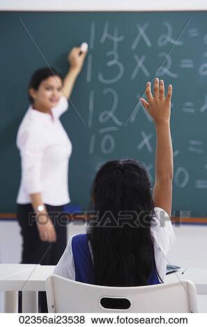 girl raises hand (back view) View Large Photo Image Stock Photo - girl raises hand (back view). Fotosearch