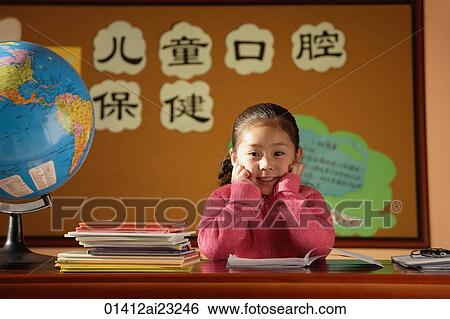 Girl sitting in class, looking at camera View Large Photo Image Stock Photograph - Girl sitting in class, looking at camera. Fotosearch