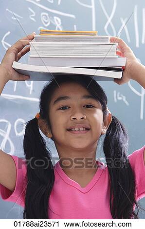 girl with books stacked on head View Large Photo Image Stock Image - girl with books stacked on head. Fotosearch