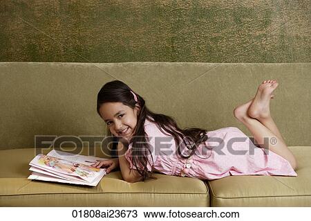 girl with storybook, barefoot, smiling at camera View Large Photo Image Stock Image - girl with storybook, barefoot, smiling at camera. Fotosearch