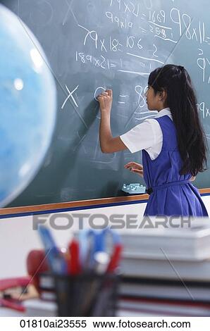 girl working at chalkboard (vertical) View Large Photo Image Stock Photography - girl working at chalkboard (vertical). Fotosearch