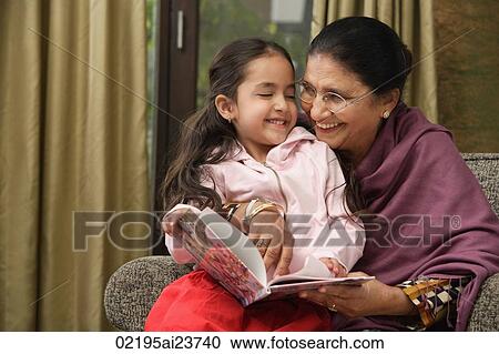 granddaughter sits on grandmother's lap for story (horizontal) View Large Photo Image Stock Image - granddaughter sits on grandmother's lap for story (horizontal). Fotosearch