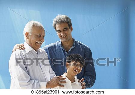 Grandfather, father, son laughing, blue background View Large Photo Image Stock Image - Grandfather, father, son laughing, blue background. Fotosearch
