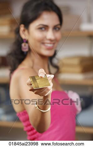 lady holding gold card View Large Photo Image Stock Photo - lady holding gold card. Fotosearch