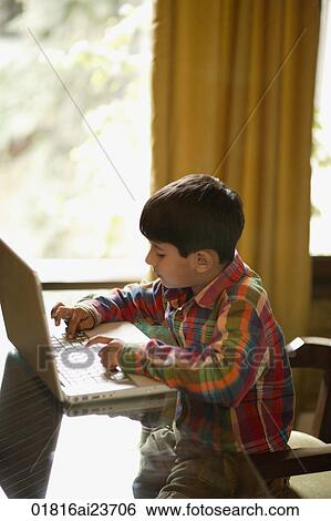 little boy working at laptop View Large Photo Image Stock Photograph - little boy working at laptop. Fotosearch