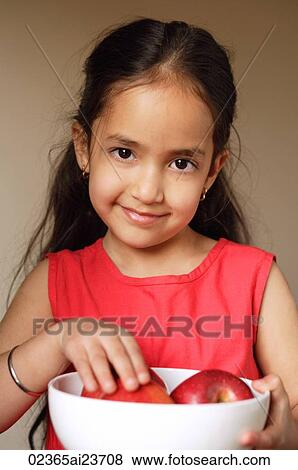 little girl holding bowl of apples, looking at camera View Large Photo Image Stock Photo - little girl holding bowl of apples, looking at camera. Fotosearch