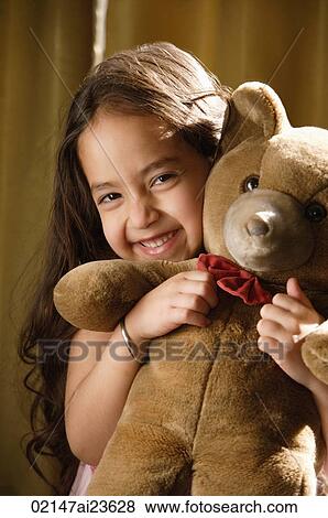 little girl hugging teddy bear View Large Photo Image Stock Photo - little girl hugging teddy bear. Fotosearch