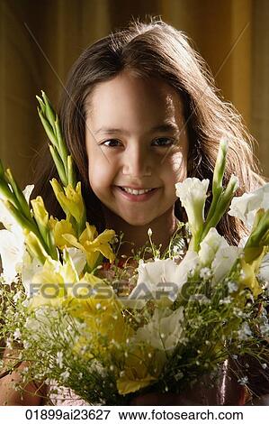 little girl smiling over bouquet of flowers View Large Photo Image Stock Photo - little girl smiling over bouquet of flowers. Fotosearch