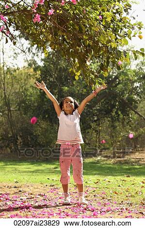 Little girl with arms up View Large Photo Image Stock Photo - Little girl with arms up. Fotosearch