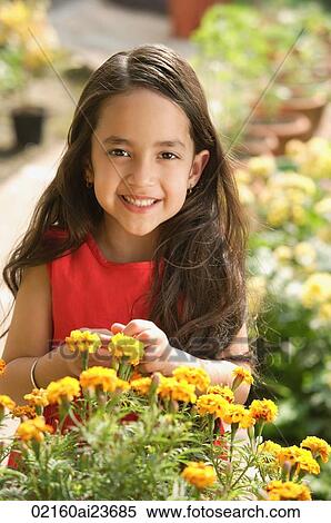 Stock Photography - little girl with flowers. Fotosearch