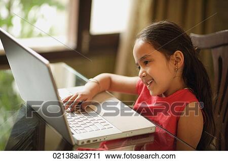 little girl working at laptop (horizontal) View Large Photo Image Stock Image - little girl working at laptop (horizontal). Fotosearch