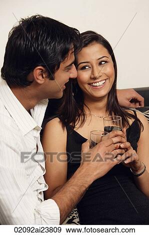 man and woman sitting closely with glasses of wine (vertical) View Large Photo Image Stock Photo - man and woman sitting closely with glasses of wine (vertical). Fotosearch