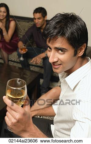 man facing camera with glass of wine View Large Photo Image Stock Photograph - man facing camera with glass of wine. Fotosearch