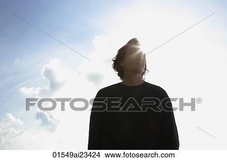 Man looking at the sky View Large Photo Image Picture - Man looking at the sky. Fotosearch