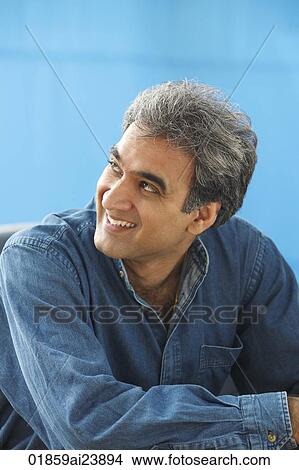 Man with gray hair, looking off and smiling View Large Photo Image Picture - Man with gray hair, looking off and smiling. Fotosearch