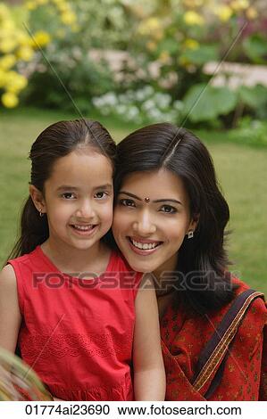 mother and daughter in garden, close up, smiling at camera View Large Photo Image Stock Image - mother and daughter in garden, close up, smiling at camera. Fotosearch