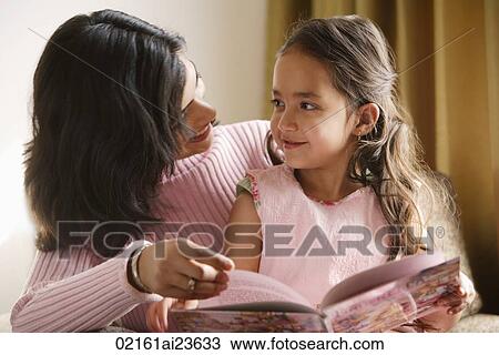 mother looks at daughter sitting on her lap View Large Photo Image Stock Image - mother looks at daughter sitting on her lap. Fotosearch