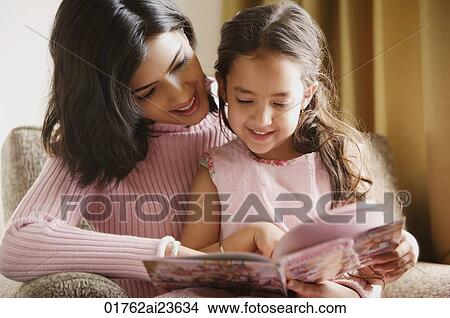 mother reads story book to her daughter View Large Photo Image Picture - mother reads story book to her daughter. Fotosearch