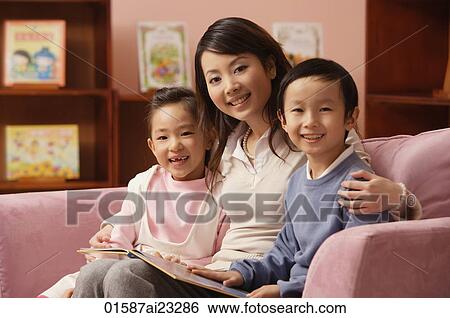 Mother with son and daughter at home View Large Photo Image Stock Photograph - Mother with son and daughter at home. Fotosearch