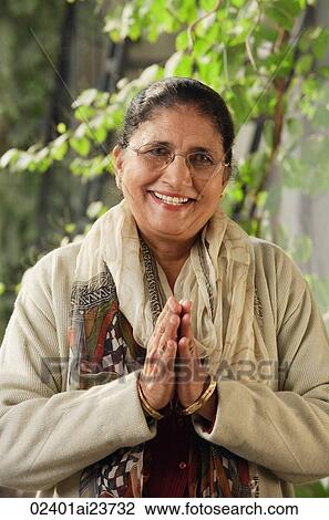 older woman with glasses giving greeting View Large Photo Image Stock Image - older woman with glasses giving greeting. Fotosearch