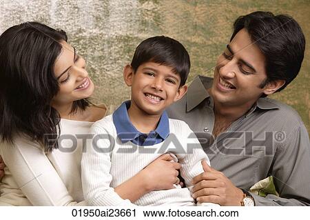 parents smile proudly at their son, son smiles at camera View Large Photo Image Stock Image - parents smile proudly at their son, son smiles at camera. Fotosearch