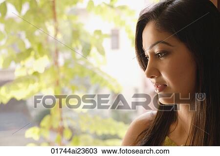 profile of woman at window, looking down View Large Photo Image Stock Image - profile of woman at window, looking down. Fotosearch