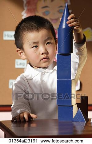 Schoolboy with building blocks View Large Photo Image Stock Image - Schoolboy with building blocks. Fotosearch