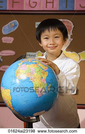 Schoolboy with globe View Large Photo Image Stock Photo - Schoolboy with globe. Fotosearch
