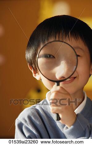 Schoolboy with magnifying glass View Large Photo Image Stock Image - Schoolboy with magnifying glass. Fotosearch