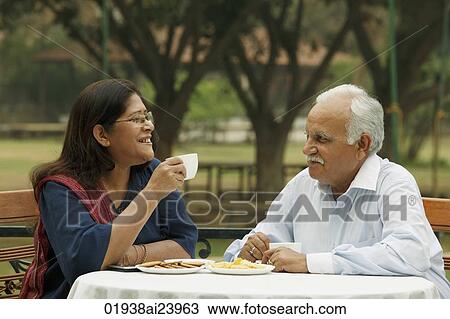 senior couple having coffee outdoors View Large Photo Image Stock Image - senior couple having coffee outdoors. Fotosearch