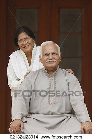 Senior couple in front of door View Large Photo Image Picture - Senior couple in front of door. Fotosearch