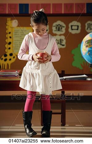 Student with apple in class View Large Photo Image Stock Photography - Student with apple in class. Fotosearch