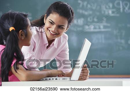teacher and girl at laptop (horizontal) View Large Photo Image Stock Image - teacher and girl at laptop (horizontal). Fotosearch