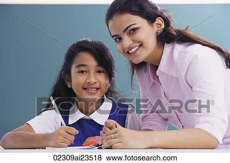 Stock Photo - teacher and student smile at camera (horizontal). Fotosearch